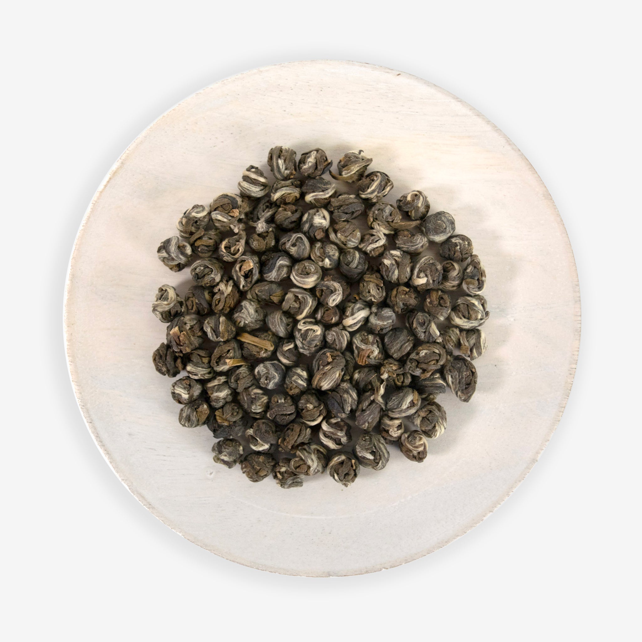 A plate with hand rolled jasmine green tea pearls.